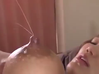 Asian Lady Squeezes Milk Off Her Breast